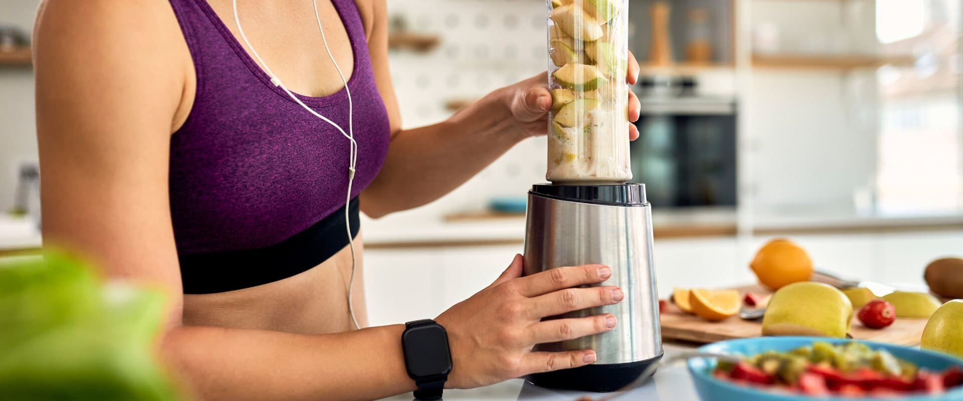 Preparing a fresh smoothie in a busy kitchen
