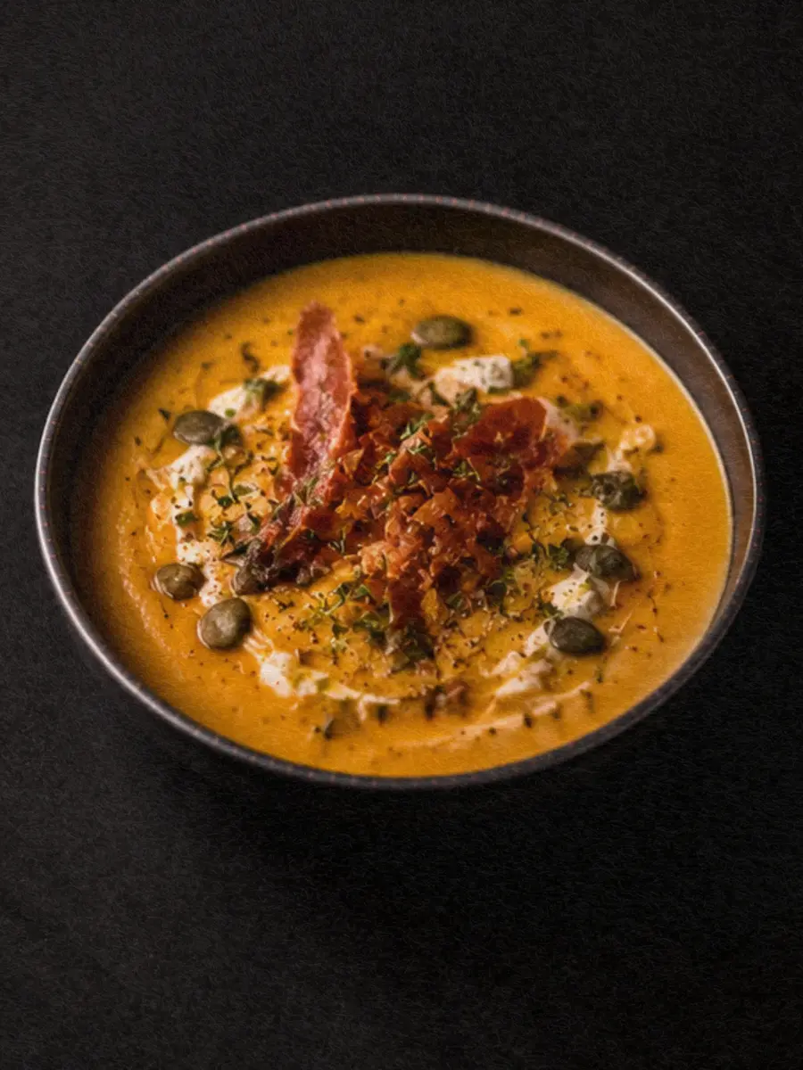 A bowl of smooth vegetable soup for a familiar home-cooked meal